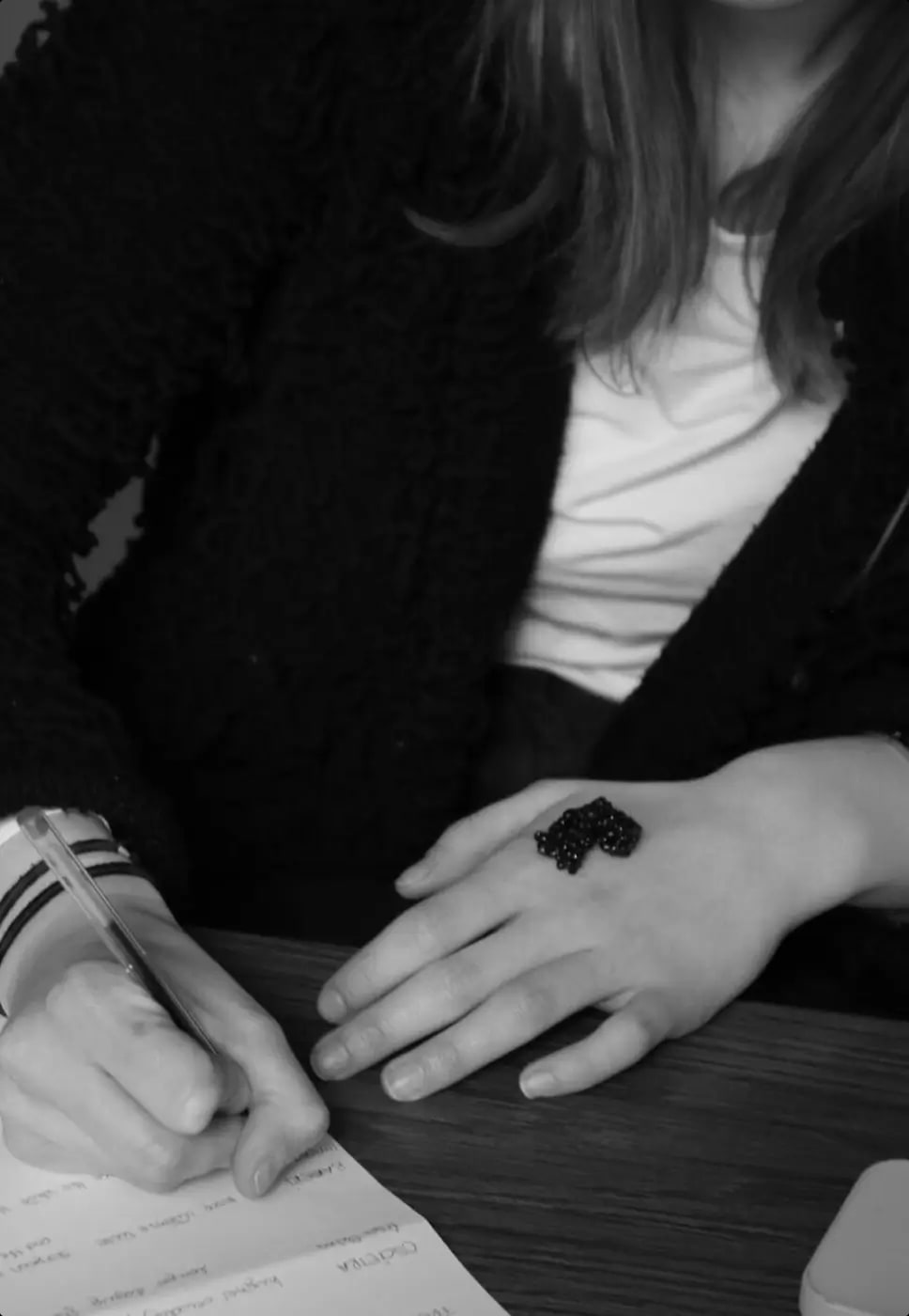 A guest tasting caviar with a mother-of-pearl spoon